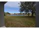 Backyard with pond and lush landscaping at 3648 Julius Estates Blvd, Winter Haven, FL 33881