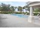 Community pool with lounge chairs and covered patio at 3648 Julius Estates Blvd, Winter Haven, FL 33881