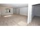 Spacious living area with carpeting and kitchen pass-through at 3648 Julius Estates Blvd, Winter Haven, FL 33881