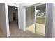 Sliding glass doors lead to a private patio and pond view at 3648 Julius Estates Blvd, Winter Haven, FL 33881