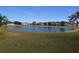 Serene pond view with homes surrounding it at 3648 Julius Estates Blvd, Winter Haven, FL 33881