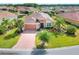 Aerial view of a single-Gathering home with landscaped yard and paved driveway at 453 Treviso Dr, Kissimmee, FL 34759