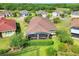 Aerial view of house and backyard screened porch at 453 Treviso Dr, Kissimmee, FL 34759