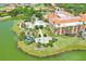 Resort-style pool and clubhouse with lush landscaping at 453 Treviso Dr, Kissimmee, FL 34759