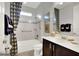 Clean bathroom with tub, shower, and dark brown vanity at 453 Treviso Dr, Kissimmee, FL 34759
