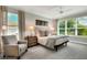 Bright and airy bedroom with king-size bed and plenty of natural light at 453 Treviso Dr, Kissimmee, FL 34759