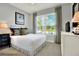 Bright bedroom with a comfortable bed and plenty of natural light at 453 Treviso Dr, Kissimmee, FL 34759