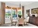 Bright breakfast nook with glass table and seating for four at 453 Treviso Dr, Kissimmee, FL 34759