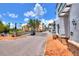 Scenic paved street with golf cart and shops at 453 Treviso Dr, Kissimmee, FL 34759