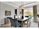 Bright dining room with a wood table and six chairs at 453 Treviso Dr, Kissimmee, FL 34759
