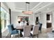 Modern dining room with a large table and natural light at 453 Treviso Dr, Kissimmee, FL 34759