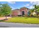 One-story home with manicured lawn and driveway at 453 Treviso Dr, Kissimmee, FL 34759