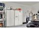 Garage with ample storage shelving and refrigerator at 453 Treviso Dr, Kissimmee, FL 34759