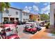 Community golf cart parking area in front of shops at 453 Treviso Dr, Kissimmee, FL 34759