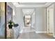 Elegant hallway with light gray walls and wood-look tile floors at 453 Treviso Dr, Kissimmee, FL 34759