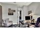 Spacious home office with glass desk, comfortable chair, and view into hallway at 453 Treviso Dr, Kissimmee, FL 34759