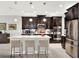Spacious kitchen with island, stainless steel appliances, and quartz counters at 453 Treviso Dr, Kissimmee, FL 34759