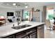 Island kitchen features a large sink and modern faucet at 453 Treviso Dr, Kissimmee, FL 34759