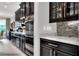 Kitchen with built-in oven, microwave, and stylish backsplash at 453 Treviso Dr, Kissimmee, FL 34759