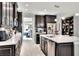 Modern kitchen with dark cabinets and white countertops at 453 Treviso Dr, Kissimmee, FL 34759