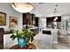 Open kitchen with breakfast bar and views into dining area at 453 Treviso Dr, Kissimmee, FL 34759