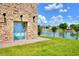 Landscaped area with lake fountain view at 453 Treviso Dr, Kissimmee, FL 34759