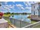 Peaceful lake view with a fountain and resort-style building at 453 Treviso Dr, Kissimmee, FL 34759