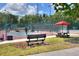 Several pickleball courts with seating and picnic area at 453 Treviso Dr, Kissimmee, FL 34759