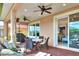 Relax on this screened patio, complete with grill and seating at 453 Treviso Dr, Kissimmee, FL 34759
