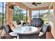 Outdoor patio with seating, table, and built-in grill at 453 Treviso Dr, Kissimmee, FL 34759