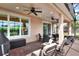 Relaxing screened patio with seating area and built-in grill at 453 Treviso Dr, Kissimmee, FL 34759