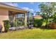 Spacious screened-in porch with flowering plants at 453 Treviso Dr, Kissimmee, FL 34759