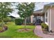 Screened porch with paver patio and lush greenery at 453 Treviso Dr, Kissimmee, FL 34759