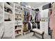 Spacious walk-in closet with custom shelving and drawers at 453 Treviso Dr, Kissimmee, FL 34759
