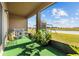 Screened patio with seating area overlooking backyard and canal at 4710 Osprey Way, Winter Haven, FL 33881