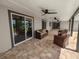 Large covered patio, wicker furniture, sliding doors at 5252 Post Ln, Lakeland, FL 33809