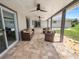 Spacious covered patio with seating and sliding doors at 5252 Post Ln, Lakeland, FL 33809