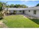 Spacious backyard with covered patio and grassy area at 5252 Post Ln, Lakeland, FL 33809