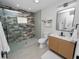 Spa-like bathroom with walk-in shower and wood vanity at 5252 Post Ln, Lakeland, FL 33809