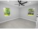 Bright bedroom with ceiling fan and large windows at 5252 Post Ln, Lakeland, FL 33809