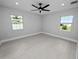 Bedroom with large windows and a ceiling fan at 5252 Post Ln, Lakeland, FL 33809