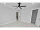 Bedroom with ceiling fan, closet, and en-suite bathroom at 5252 Post Ln, Lakeland, FL 33809