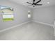 Well-lit bedroom with two windows and ceiling fan at 5252 Post Ln, Lakeland, FL 33809