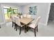 Bright dining room with a wood table and six chairs at 5252 Post Ln, Lakeland, FL 33809
