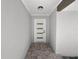 Modern entryway with a clean, minimalist design and tile flooring at 5252 Post Ln, Lakeland, FL 33809