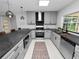 Updated kitchen with stainless steel appliances and gray cabinets at 5252 Post Ln, Lakeland, FL 33809
