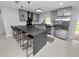 Modern kitchen featuring stainless steel appliances and dark countertops at 5252 Post Ln, Lakeland, FL 33809