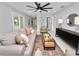 Bright living room with comfy seating and large sliding glass doors at 5252 Post Ln, Lakeland, FL 33809