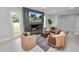 Living room with modern fireplace and comfortable seating at 5252 Post Ln, Lakeland, FL 33809