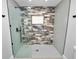 Large walk-in shower with multi-toned tile and glass enclosure at 5252 Post Ln, Lakeland, FL 33809